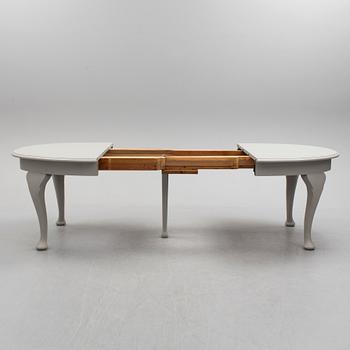 A painted Rococo style dining table, circa 1900.