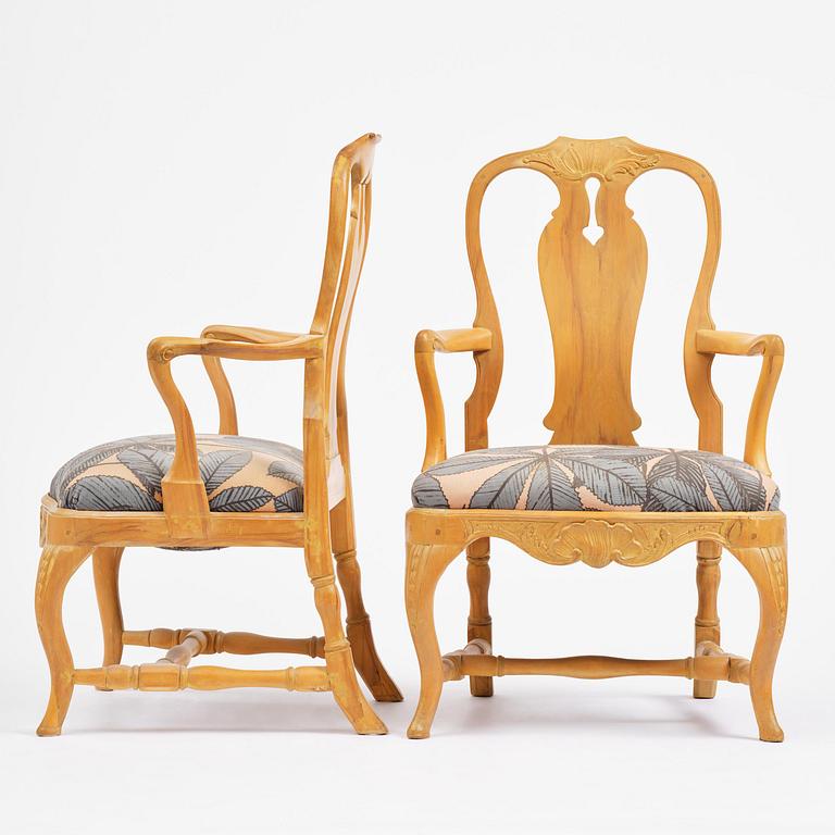 A pair of rococo open-back armchairs, Stockholm, later part 18th century.