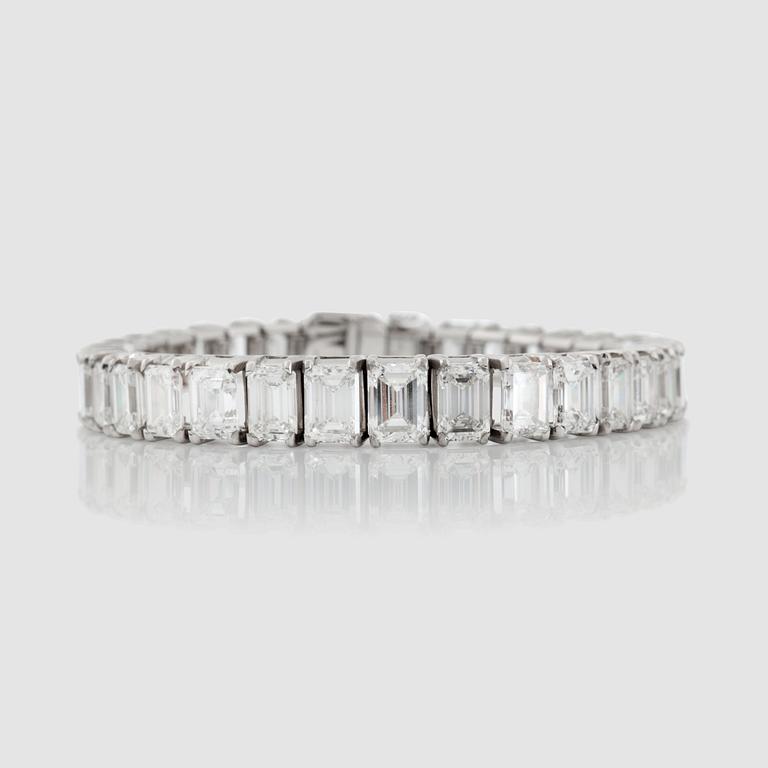 An emerald-cut diamond bracelet. Total carat weight circa 30.00 cts.