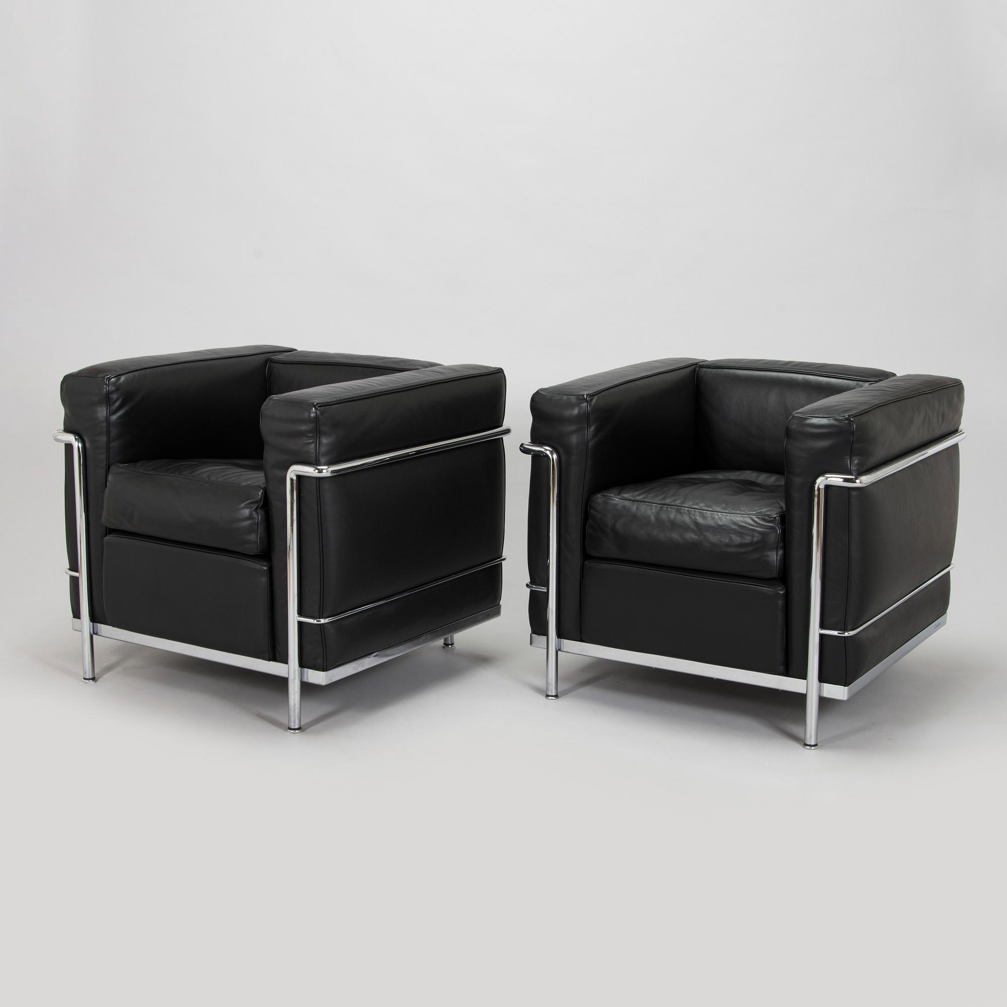 Pierre Jeanneret, Charlotte Perriand & Le Corbusier, a pair of 'LC2' armchairs, Cassina, Italy.