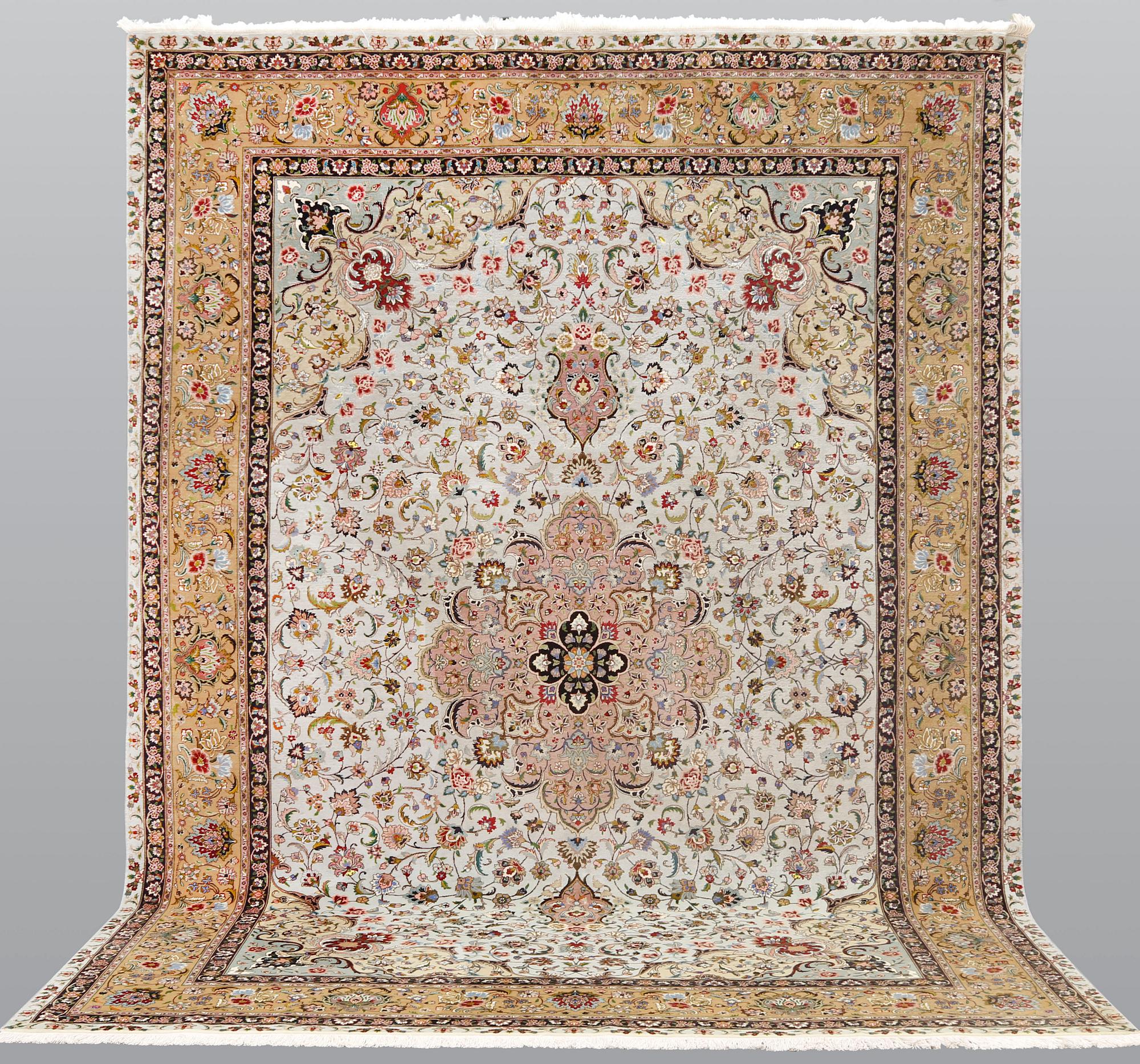 A part silk Tabriz carpet, so-called 50 Raj, approx. 348 x 252 cm.