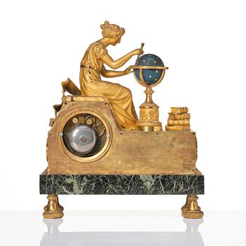 A patinated, ormolu, and marble French Empire figural mantel clock, early 19th century.