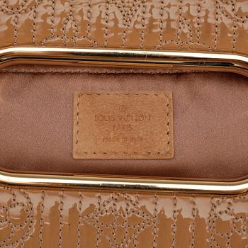 LOUIS VUITTON, a beige suede monogrammed clutch with patent details.