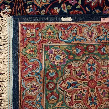 A CARPET. A semi-antique Kerman. 614,5 x 360,5 cm.