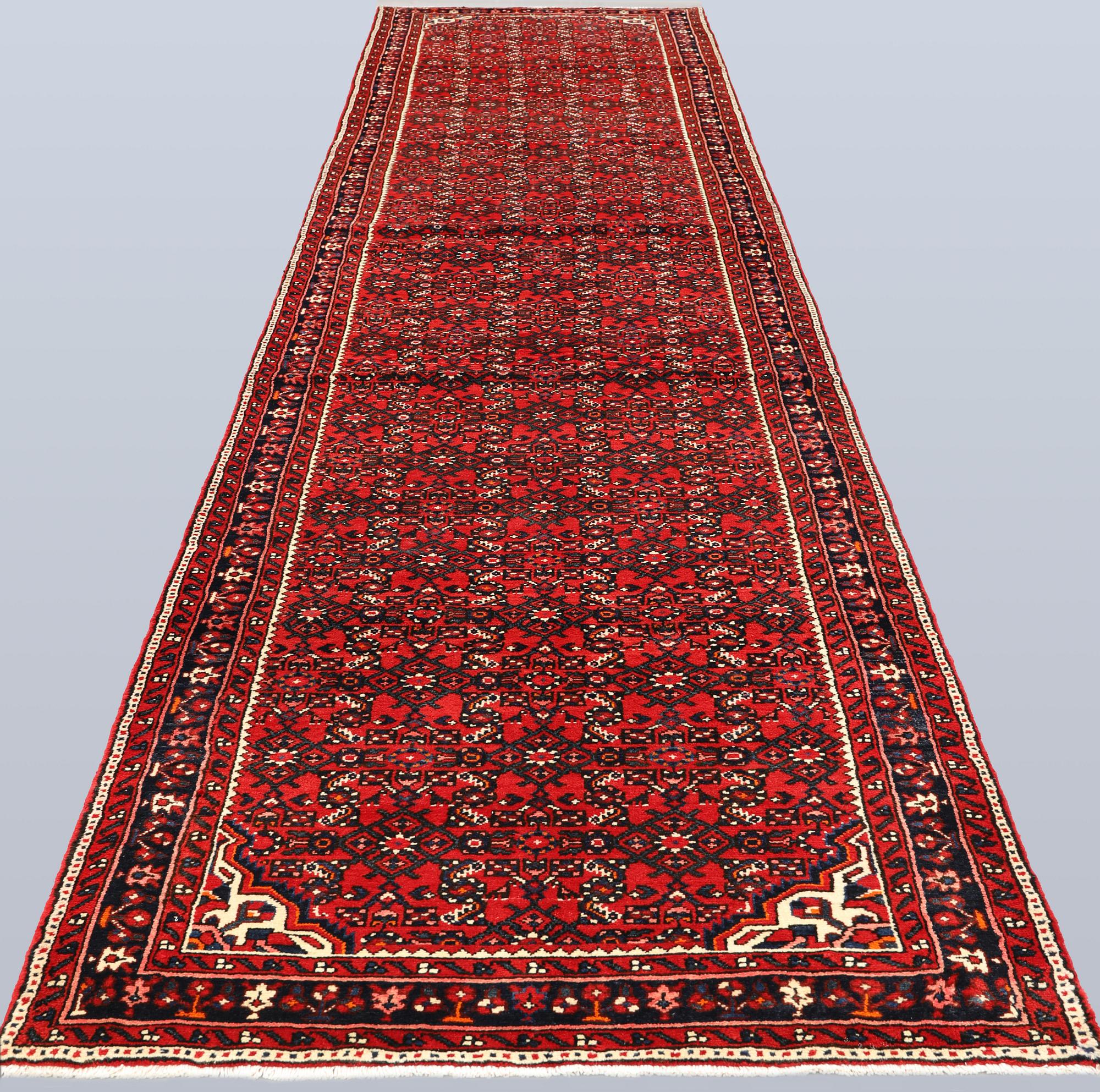 A Hosseinabad runner, approx. 508 x 110 cm.