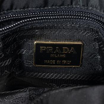 Prada, A black nylon bag.