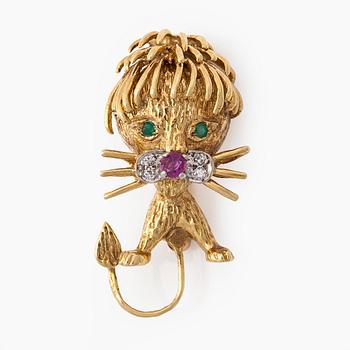 A 16,5K gold brooch with ruby, emeralds and diamonds.