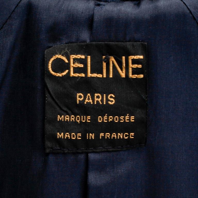 CÉLINE, a dark blue cashmere and wool coat.