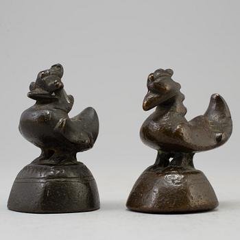 Two opium weights, Burma, circa 1900.