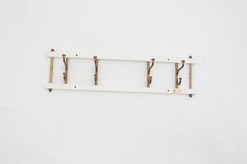 A painted 'Dekorativ' coat hanger, AB Skoglunds metallgjuteri AB, Anderstorp, mid 20th Century.