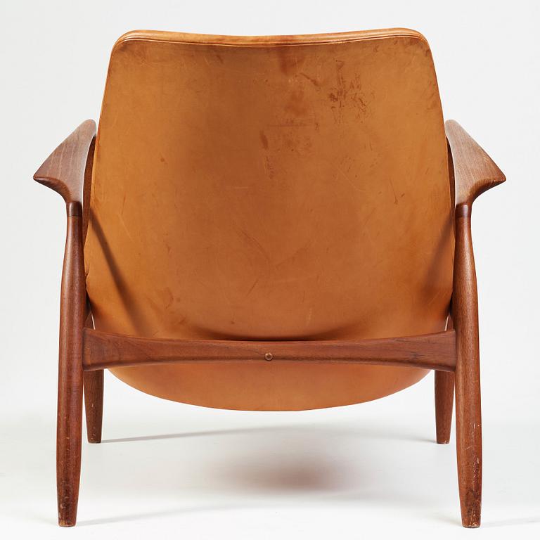 Ib Kofod-Larsen, a "Seal" teak and brown leather armchair, Olof Persson Möbler, Jönköping, Sweden 1950-60's.