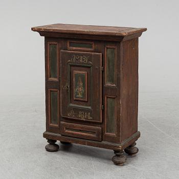 A painted cabinet, marked 1814.