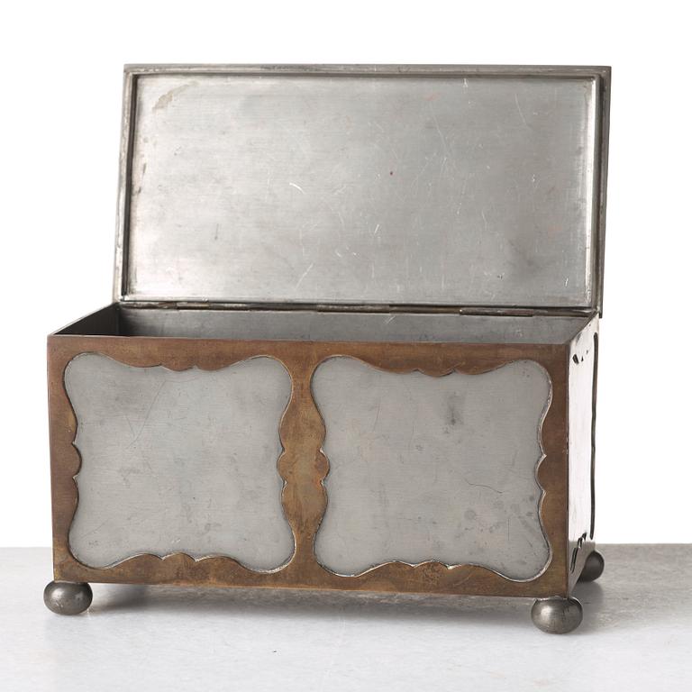 Firma Svenskt Tenn, a pewter and brass box, Stockholm 1930, model A 854.