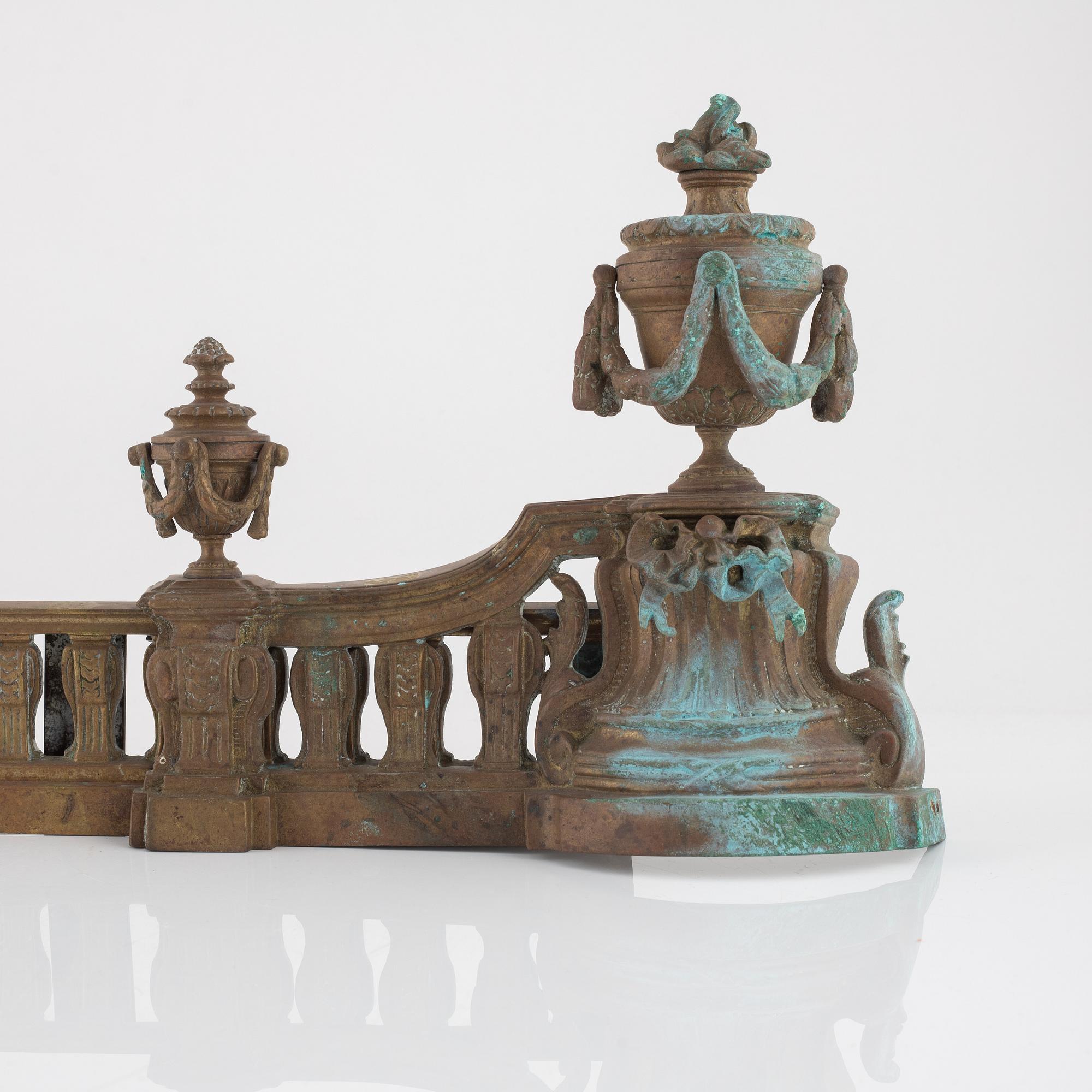 A Louis XVI style bronze grate, 19th Century.