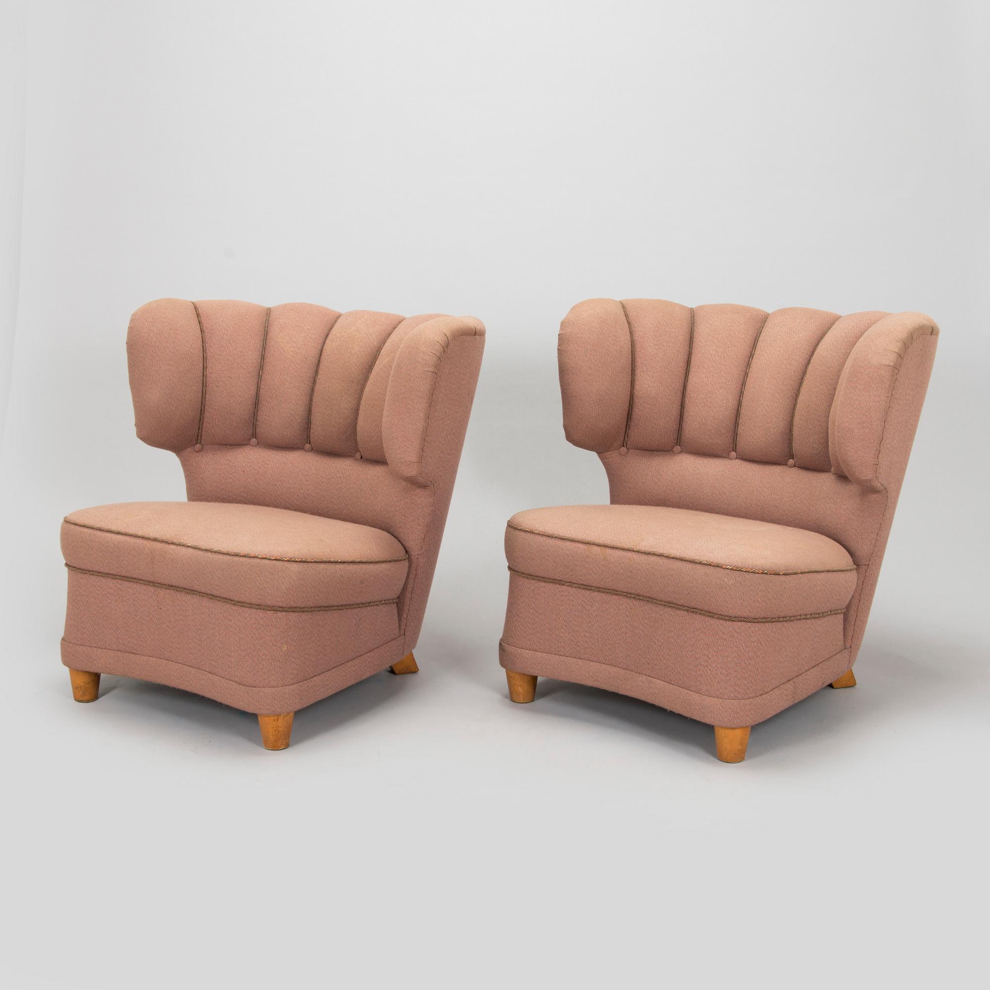 A pair of mid-20th century armchairs.