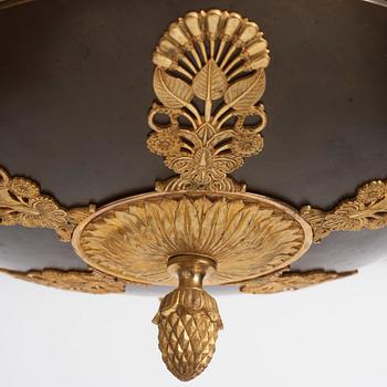 An Empire.style five-branch patinated and gilt bronze chandelier, later part of the 19th century.