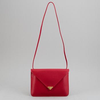 YVES SAINT LAURENT, a red leather bag.