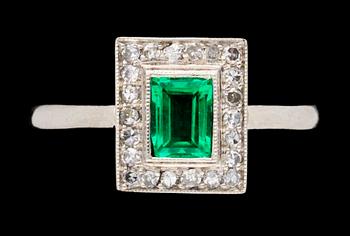 680. A platinum, emerald and diamond Art Deco ring.