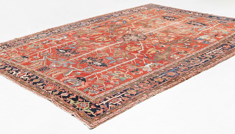A antique Heriz carpet, ca 384 x 275 - 290 cm.