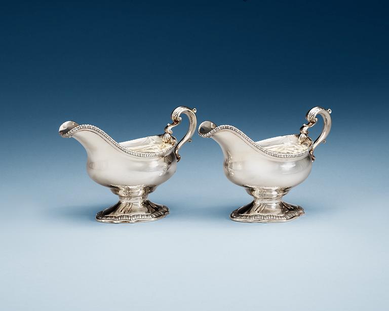 A pair of English 18th century silver sauce boats, makers mark of William Skeen, London 1766-1767.