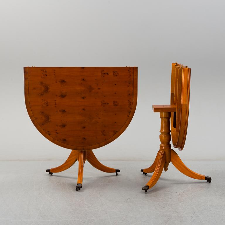 A late 20th century English style dining table and six chairs.