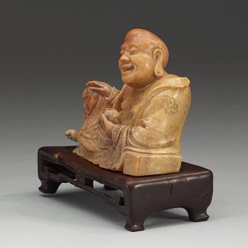 A stone figure of Budai, presumably late Qing dynasty (1644-1912).