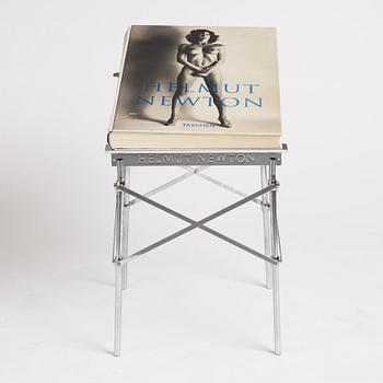 Helmut Newton, Signed book published by Taschen, Monte Carlo, 1999, ed 10000, with a metal table.