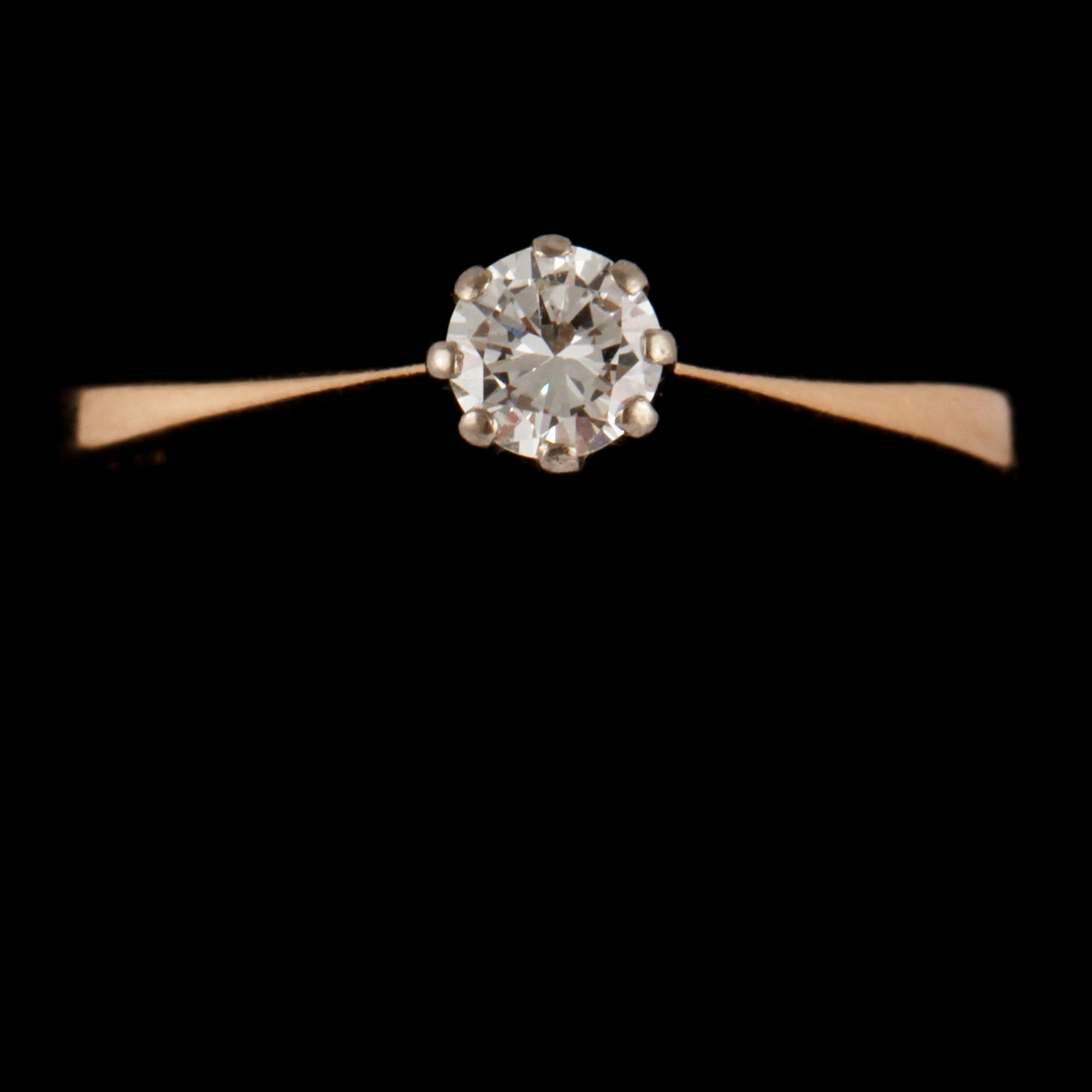 RING, 18k guld och vitguld med briljantslipad diamant, 0.24 ct,  Kaplans, Stockholm, 1990. Vikt 2 g.