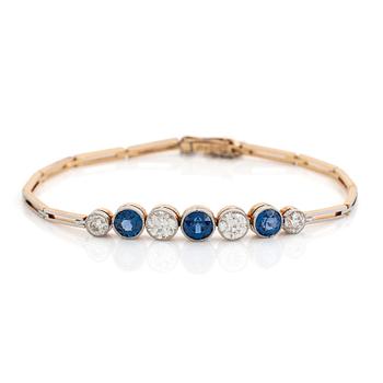 468. An 18K gold bracelet set with sapphires and old-cut diamonds.