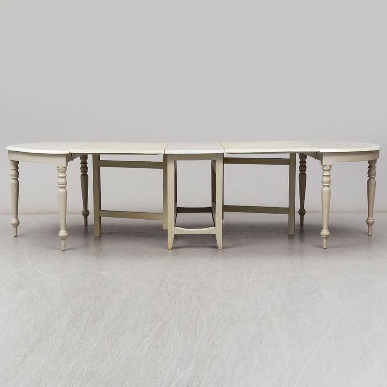 A 19th century dining table in three parts.