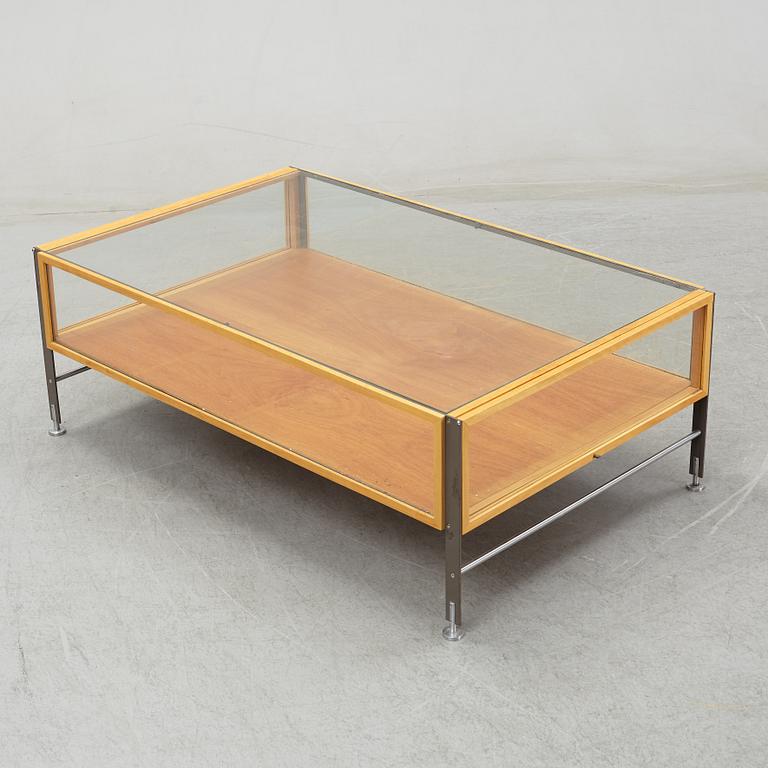A glass top coffee table, late 20th Century.