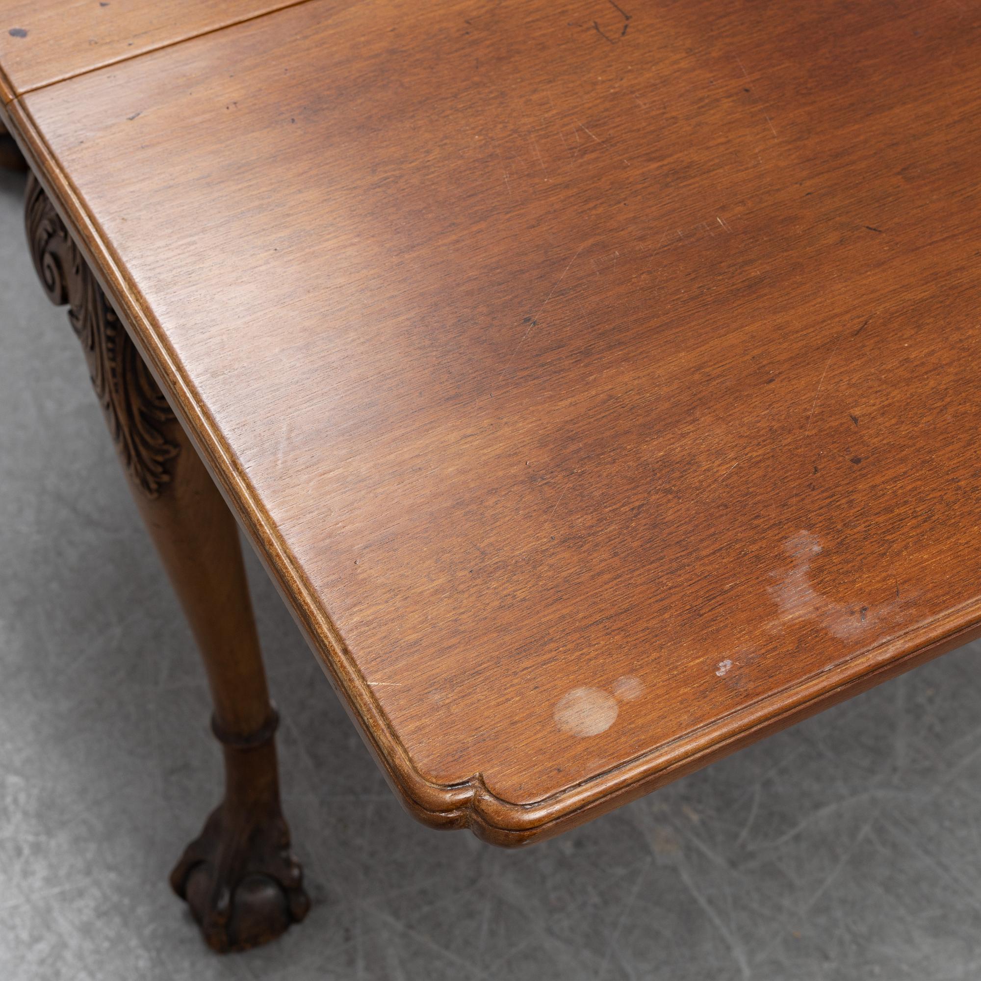 An English mahogany table, 19th Century.