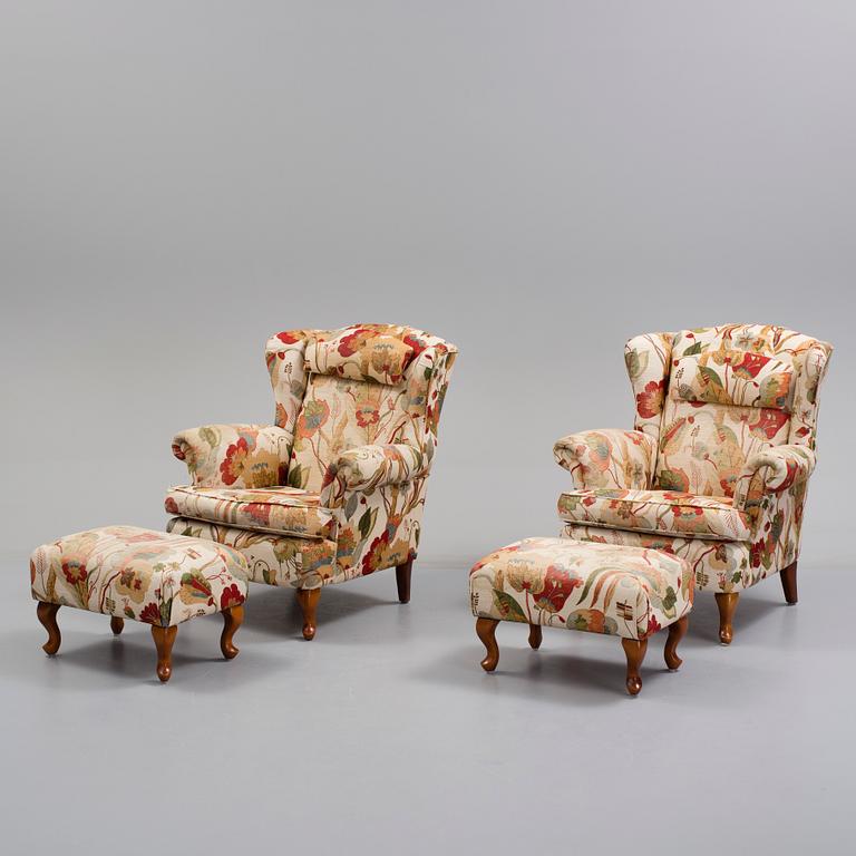 A pair of 20 th century arm chairs.