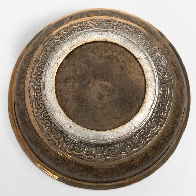 Two Tibetan bowls, low-grade silver and burl-wood, Early 20th century.