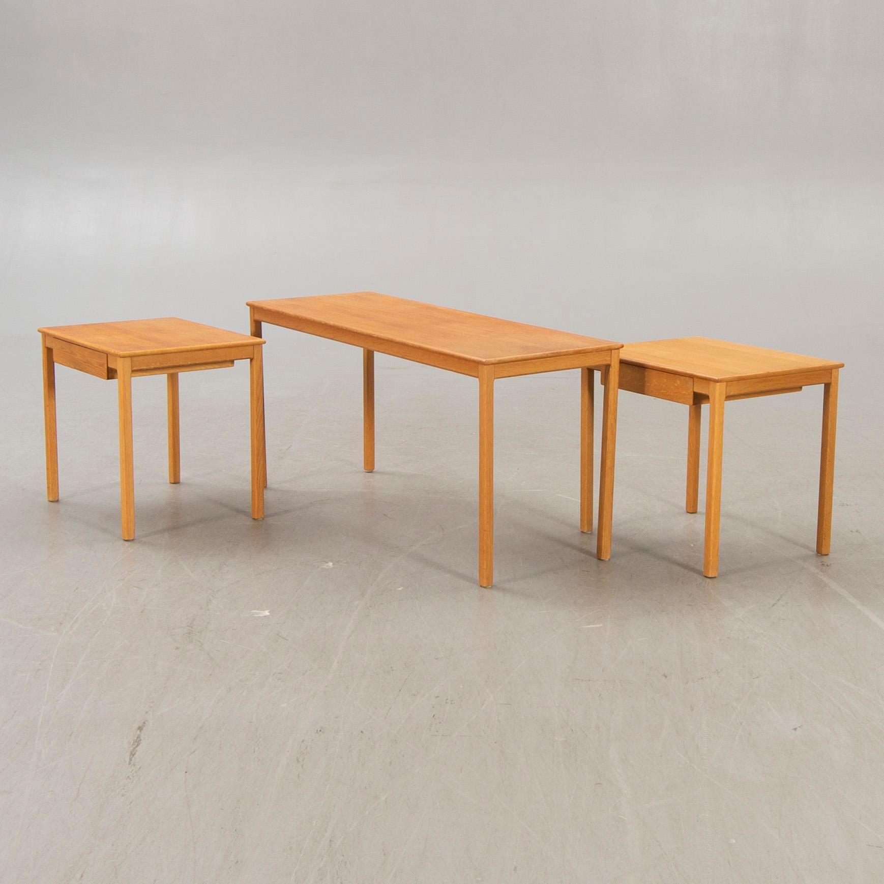 A 1960s oak nesting table.