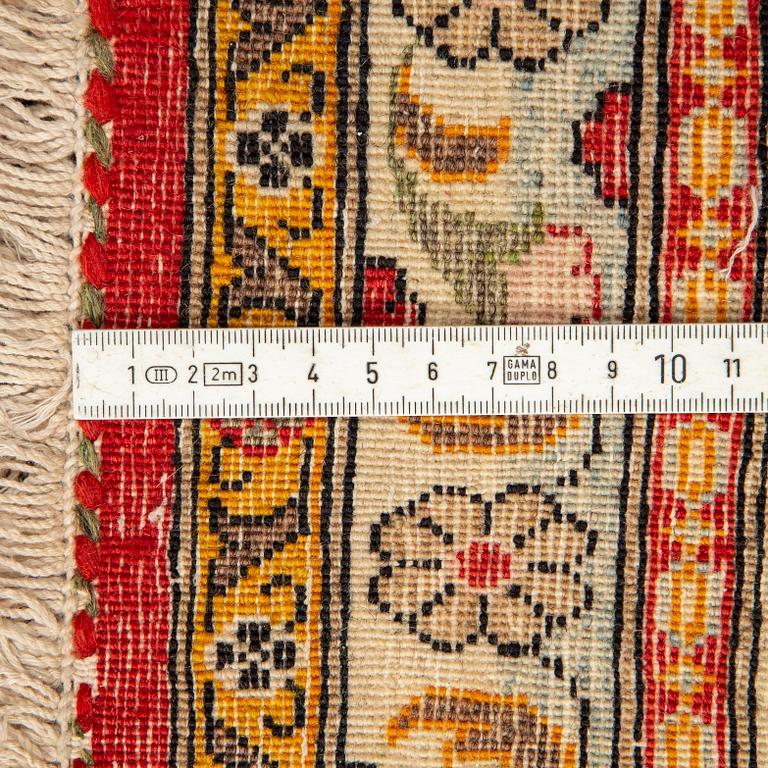A CARPET, semi-antique Qum, ca 341 x 238 cm.