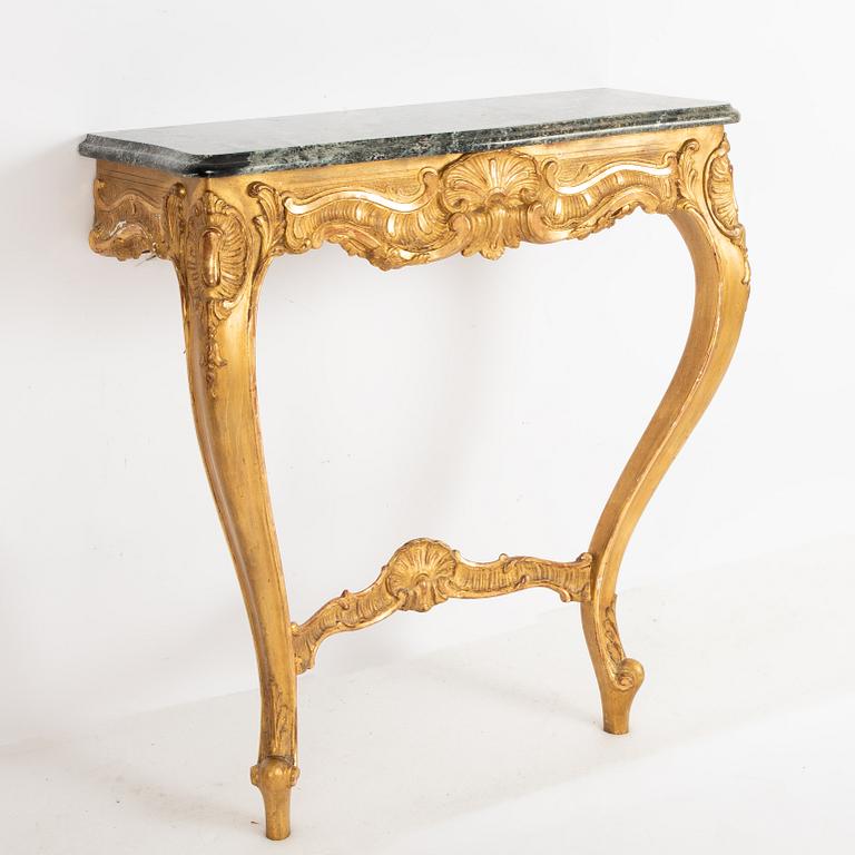 A Rococo style mirror and a console table, first half of the 20th Century.