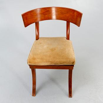 A set of four mahogany chairs around 1900.