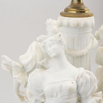 A parian and metall table lamp, first half of the 20th century.