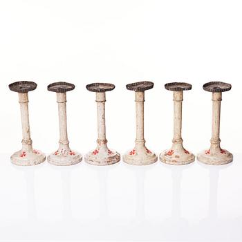 A set of six Empire wooden candlesticks, early 19th century.
