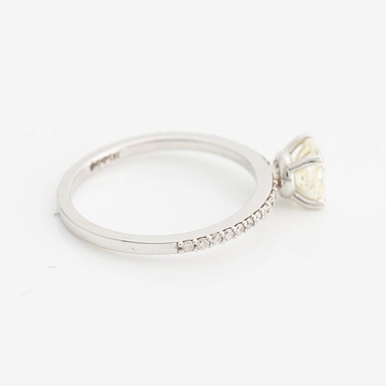 Ring with cushion-cut yellow diamond.