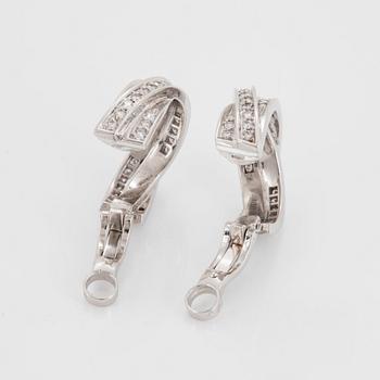 A pair of Cartier "Trinity" earrings in 18K white gold set with round brilliant-cut diamonds.