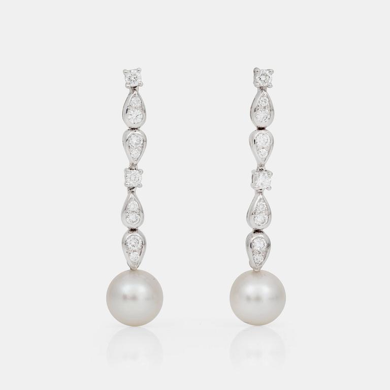 A pair of Boucheron diamond, 0.86 cts, and cultured pearl earrings.