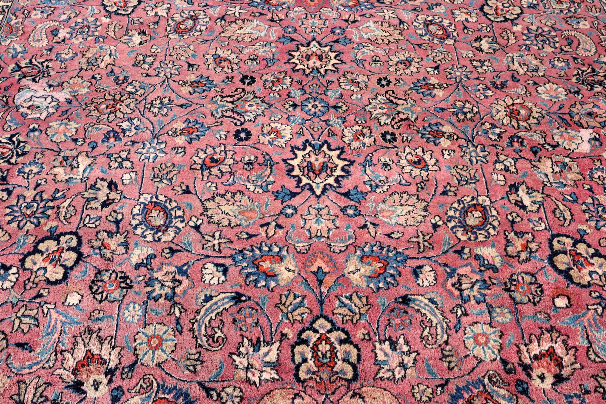 An antique Mashad carpet, signed Saber, c. 405 x 295 cm.