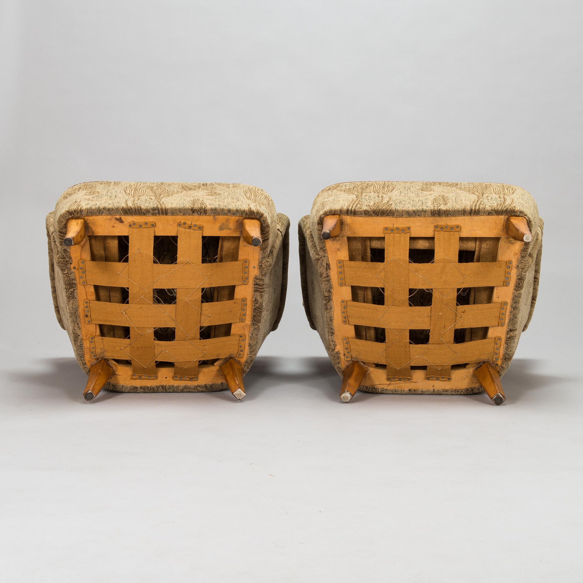 A pair of 1950s armchairs.