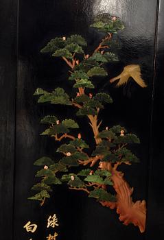 A Japanese 20th century lacquered folding screen with stonework,