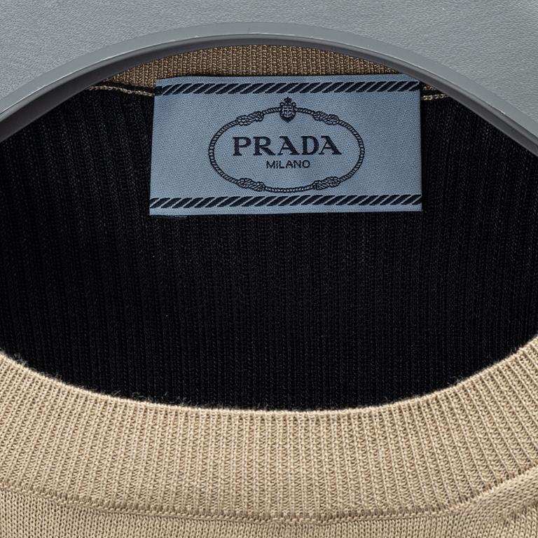 Prada, a wool/silk sweater, size 40.