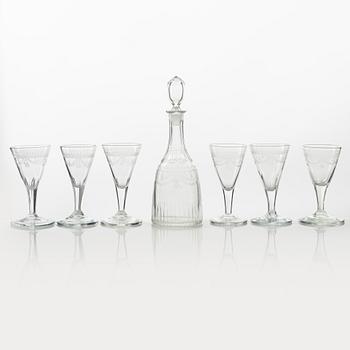 A set of six engraved glasses and one decanter, possibly Strömbäcks or Reijmyre, early 19th Century.