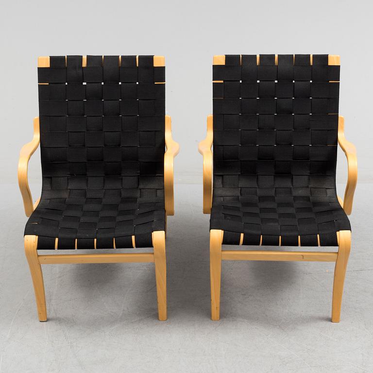 a pair of "Mina" armchairs by Bruno Matsson.