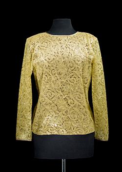 A 1990s golden blouse by Yves Saint Laurent.